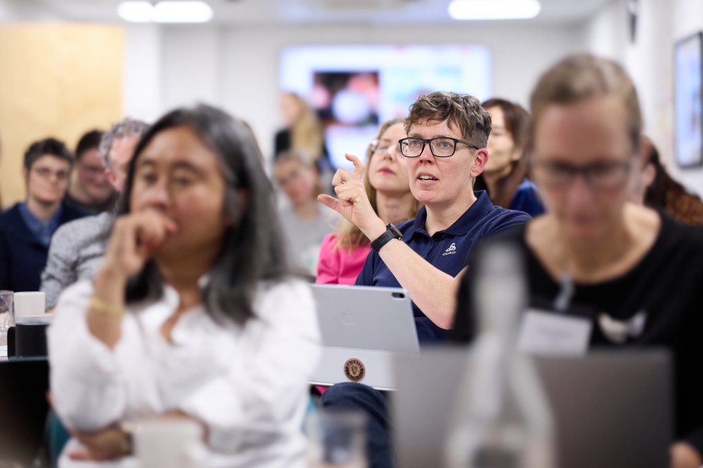 An audience member asking a question during a Centre Day presentation.